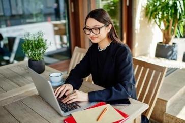 Woman working on computer at a table